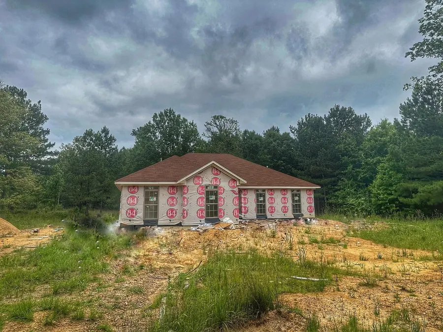Brick custom home taking shape on a cleared wooded lot in Bogue Chitto, Mississippi