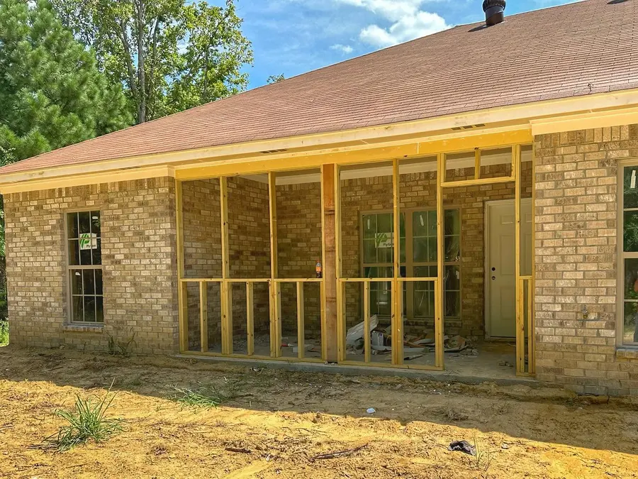 Back porch framed for screens on a new brick home